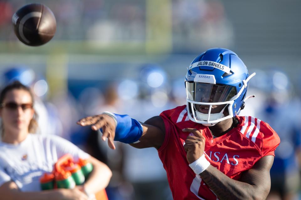 Kansas junior quarterback Jalon Daniels throws a pass during a preseason practice in 2022