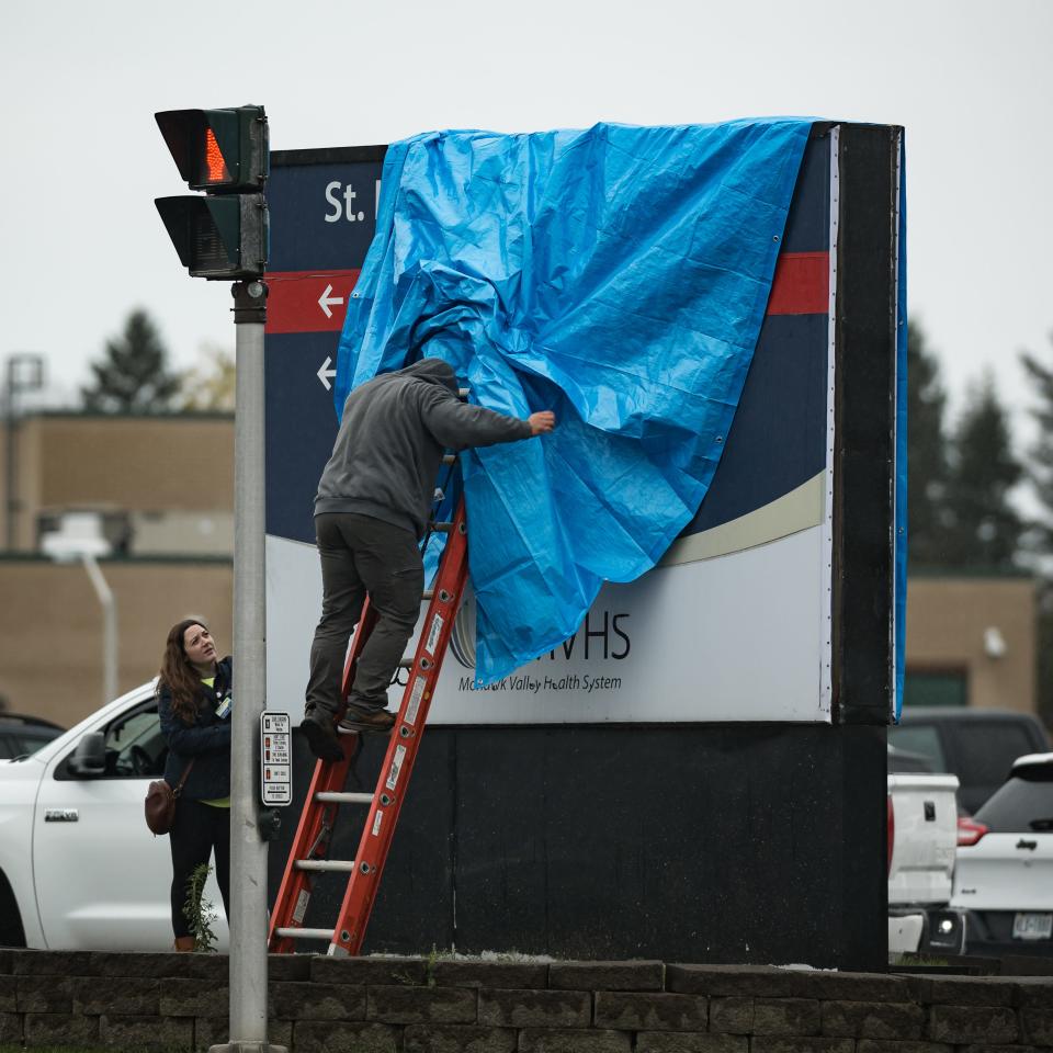 The entrance sign to Faxton-St. Luke's Hospital is dismantled as Mohawk Valley Health System officially opened the Wynn Hospital at 6 a.m. on Sunday, October 29, 2023.