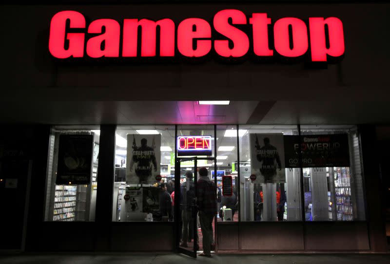 FILE PHOTO: People enter a GameStop store during "Black Friday" sales in Carle Place, New York