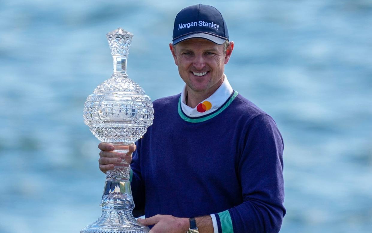 Justin Rose with the trophy - USA TODAY Sports/Ray Acevedo