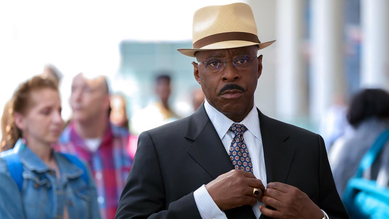  Courtney B. Vance as Jeremy Horne in a suit and hat in Heist 88 