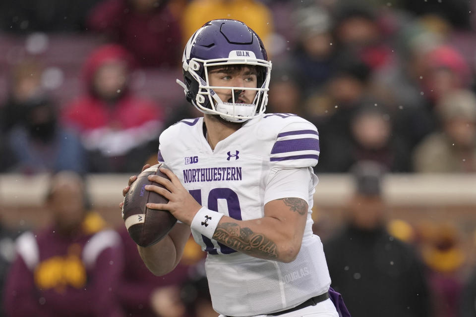 Northwestern quarterback Brendan Sullivan (10) looks to pass during the first half of an NCAA college football game against Minnesota, Saturday, Nov. 12, 2022, in Minneapolis. (AP Photo/Abbie Parr)