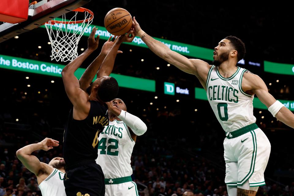May 7, 2024; Boston, Massachusetts, USA; Boston Celtics forward Jayson Tatum (0) blocks a shot by Cleveland Cavaliers forward Evan Mobley (4) during the first quarter of game one of the second round of the 2024 NBA playoffs at TD Garden. Mandatory Credit: Winslow Townson-USA TODAY Sports