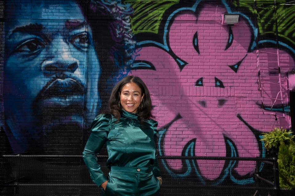 President and CEO of Newark Symphony Hall Talia Young poses for a photo by the outdoor mural on Thursday, September 21, 2023.