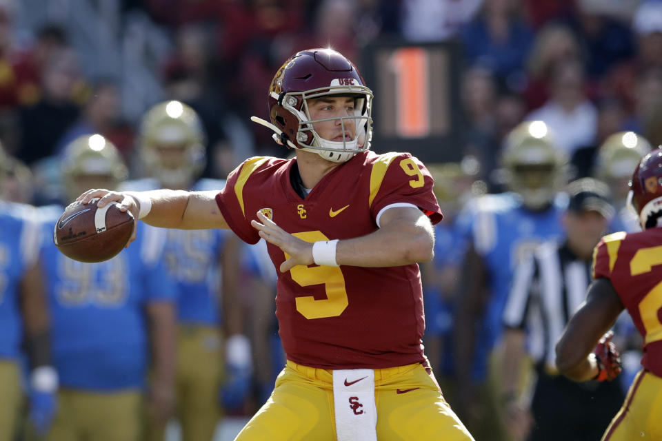 FILE - In this Nov. 23, 2019, file photo, Southern California quarterback Kedon Slovis throws against UCLA during the first half of an NCAA college football game, in Los Angeles. Slovis was selected as The Associated Press Pac 12 Conference team Newcomer of the Year and will start his sophomore year in November. (AP Photo/Marcio Jose Sanchez, File)