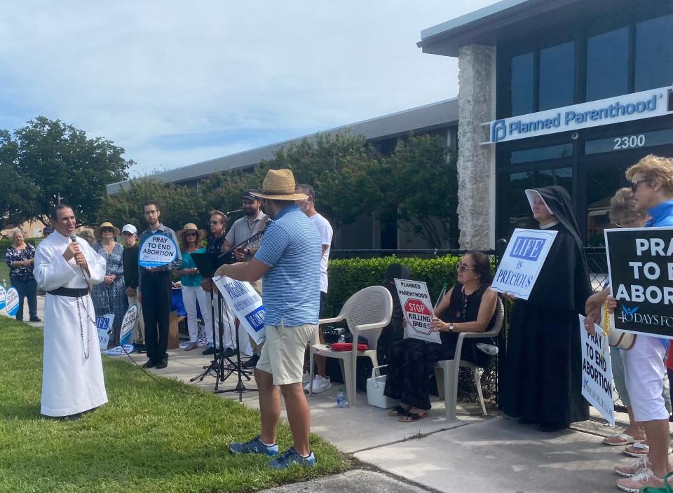 An anti-abortion group gathered Sept. 23 to pray in front of West Palm Beach’s Planned Parenthood last month.