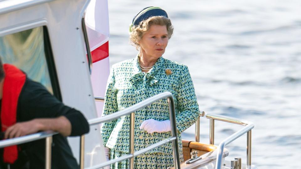 The Crown's Imelda Staunton is seen filming scenes in Scotland as Queen Elizabeth II. Crew were busy filming a boat scene in the harbor town of Macduff, Scotland.