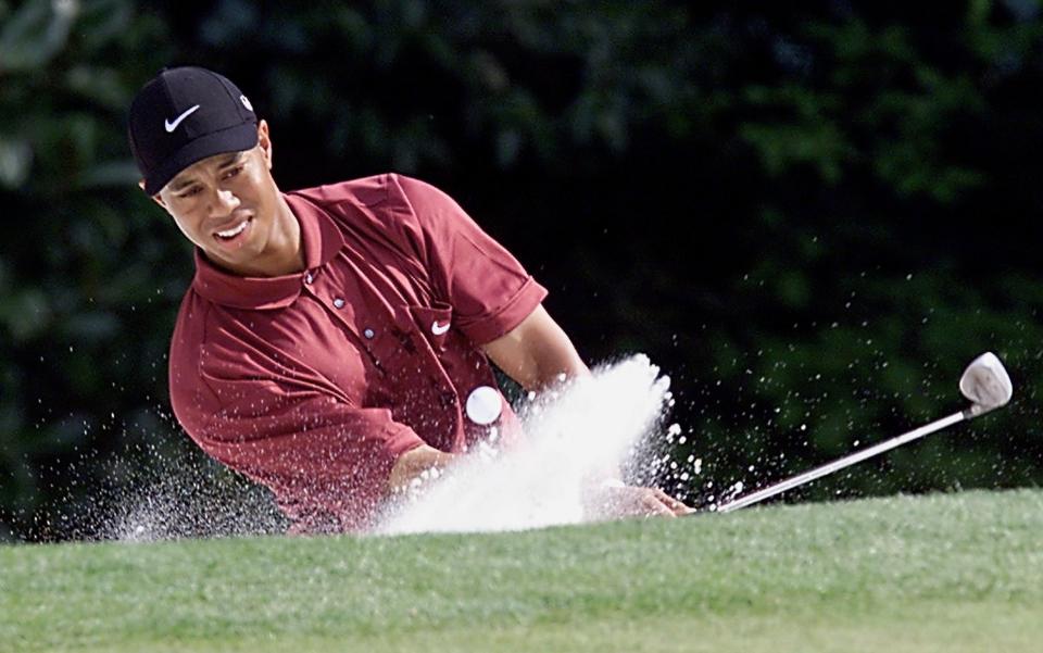 Tiger Woods of the US comes out of a sand trap on the 5th hole at the Augusta National Golf Club 08 April 2001 during the final round of the 2001 Masters golf tournament in Augusta, Georgia. Woods started the round in at 11 under-par for the tournament.   AFP PHOTO/Timothy A. CLARY (Photo by Timothy A. CLARY / AFP) (Photo by TIMOTHY A. CLARY/AFP via Getty Images)