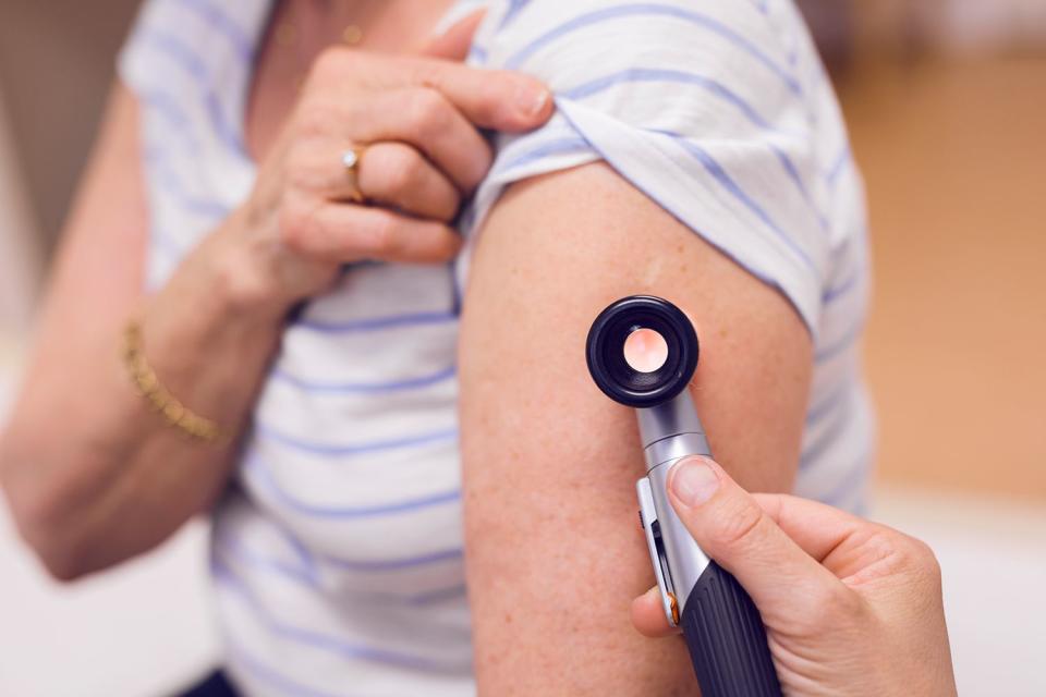 <p>Getty</p> Stock image of doctor examining senior woman