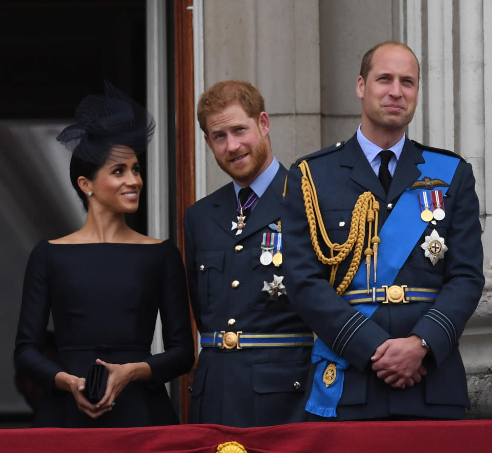 Meghan, Harry and William watch the RAF centenary in July 2018 [Photo: PA]