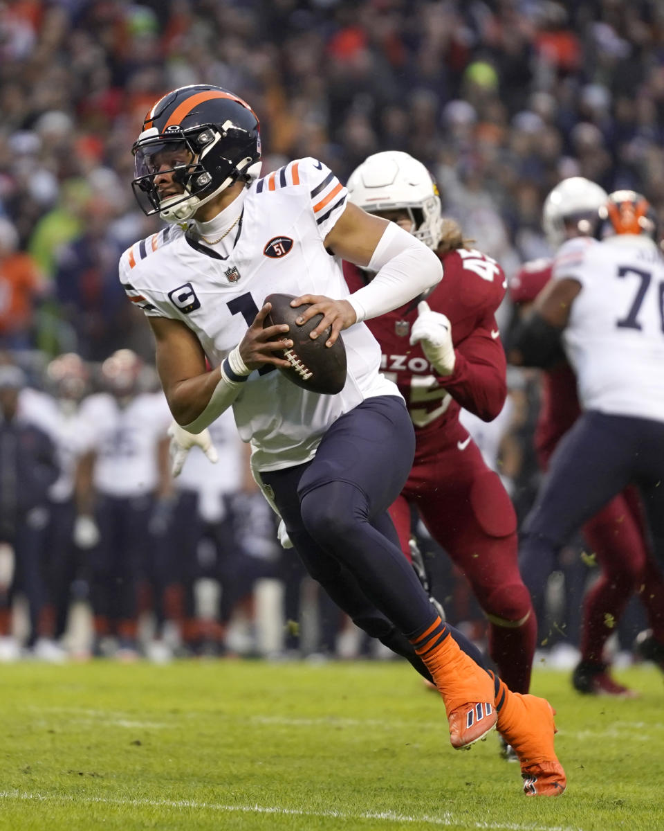 Chicago Bears quarterback Justin Fields heads too the end zone for a touchdown during the first half of an NFL football game against the Arizona Cardinals Sunday, Dec. 24, 2023, in Chicago. (AP Photo/Erin Hooley)