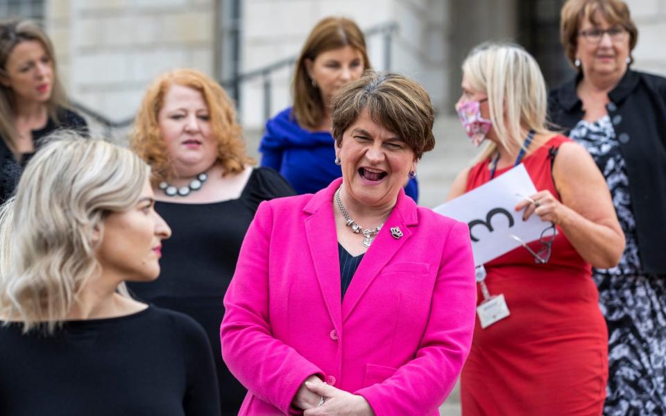 Former DUP leader Arlene Foster (pink blazer) interacts with MLA's during a photocall for female MLA's on the steps of Parliament Buildings at Stormont. PA Photo. Picture date: Tuesday June 08 2021. - Liam McBurney/PA Wire