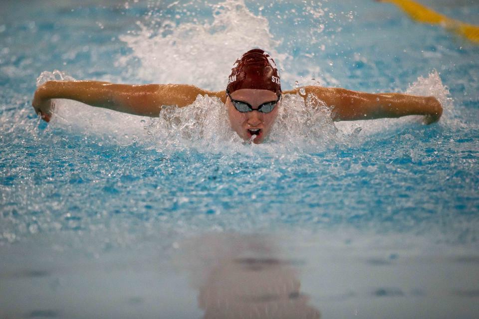 Holland Christian's Maria Heeres competes in the 200 yard IM Tuesday, Sept. 13, 2022, at the Holland Aquatic Center. 