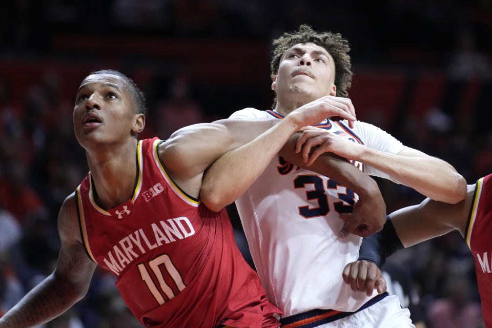 Maryland's Julian Reese (10) blocks out Illinois' Coleman Hawkins during the first half of an NCAA college basketball game Sunday, Jan. 14, 2024, in Champaign, Ill. (AP Photo/Charles Rex Arbogast)