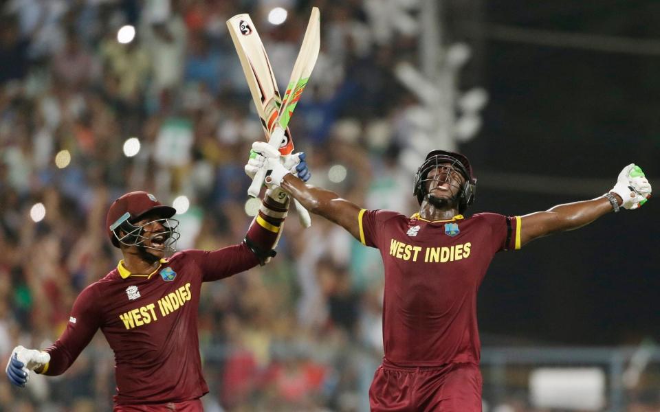 Carlos Brathwaite (right) celebrates after his big hitting helped West Indies beat England in the 2016 T20 World Cup final