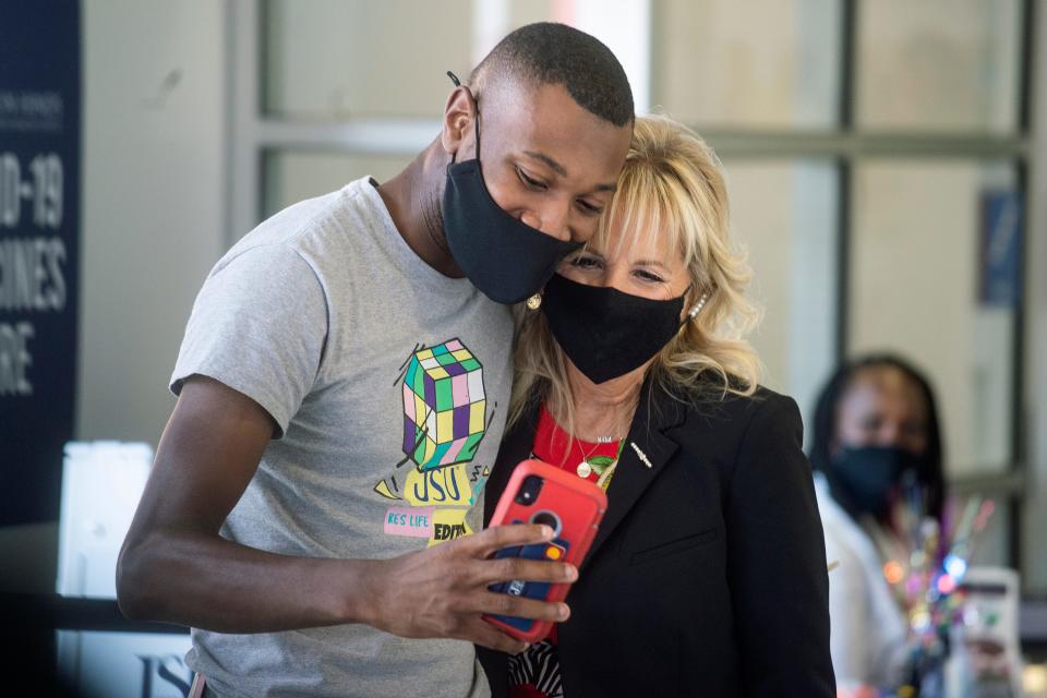 First Lady Jill Biden, right, takes a photo with Bryan Wilson after receiving his COVD-19 vaccination during the First Lady's visit at Jackson State University in Jackson, Miss., Tuesday, June 22, 2021.