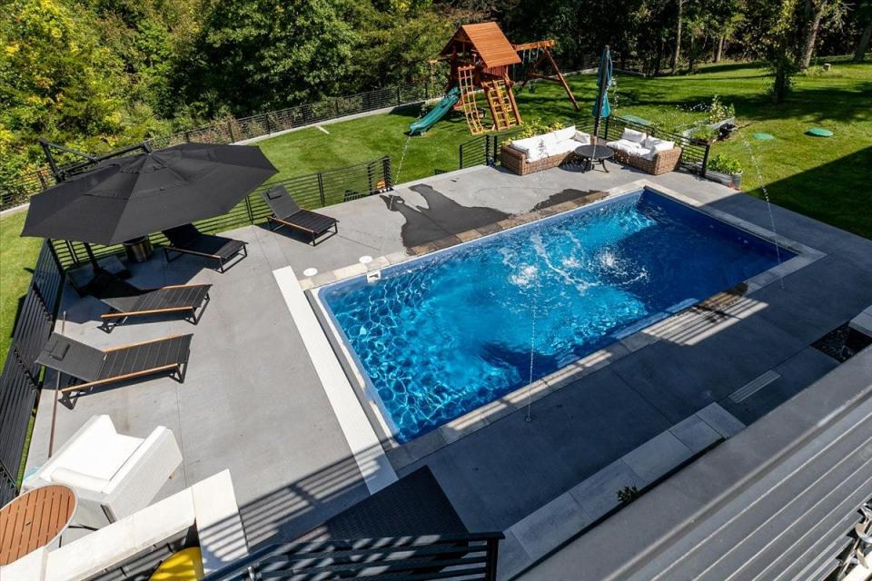 Spend your summer by the 16-by-30-foot covered and heated built-in fiberglass pool.