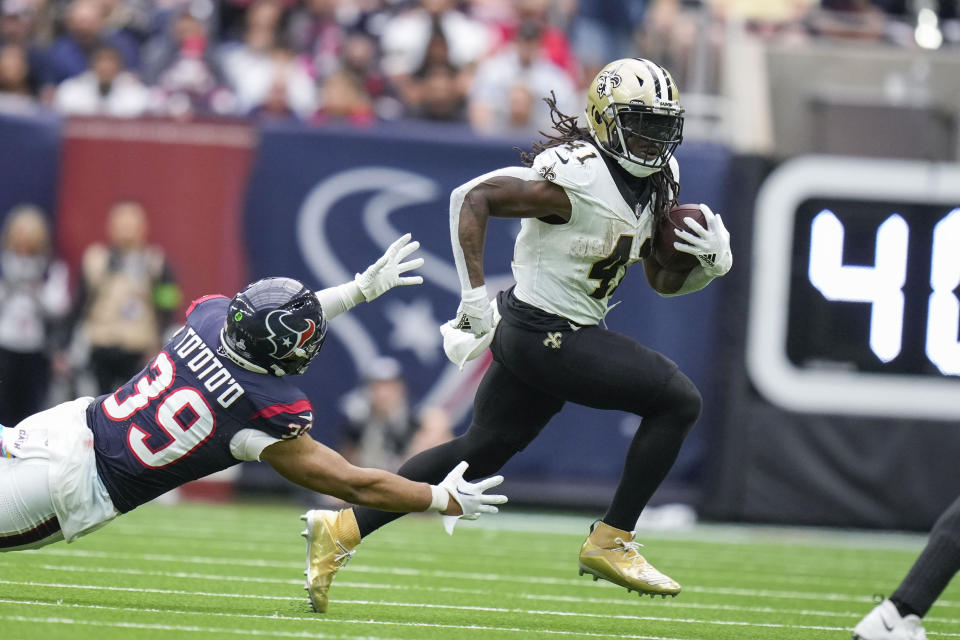 New Orleans Saints running back Alvin Kamara (41) carries against Houston Texans linebacker Henry To'oTo'o (39) in the second half of an NFL football game in Houston, Sunday, Oct. 15, 2023. (AP Photo/Eric Christian Smith)
