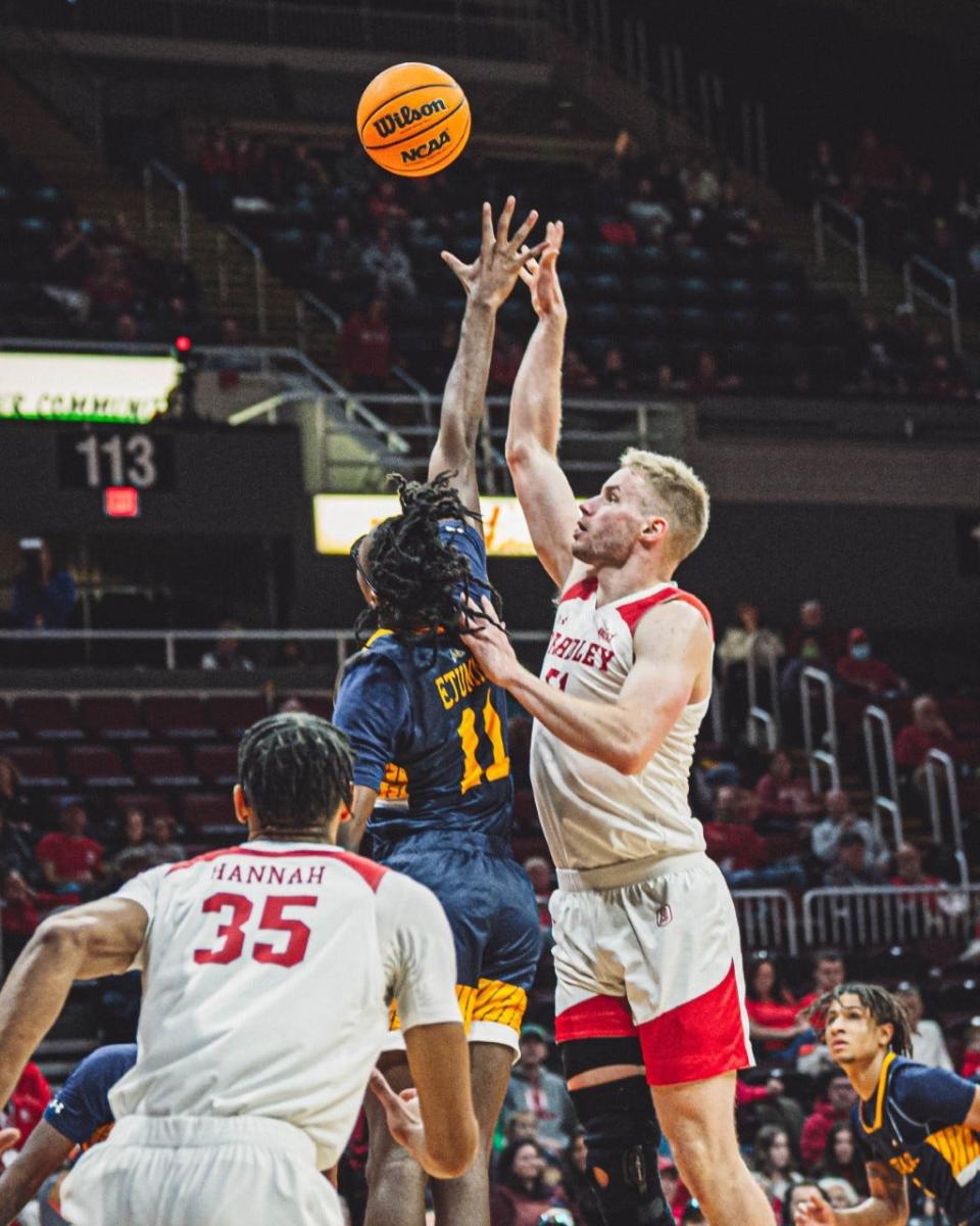 Bradley center Rienk Mast fights for the ball against Bryan Etumnu in his season debut during the Braves' 83-41 blowout win over Merrimack at Carver Arena on Saturday, Nov. 26, 2022.