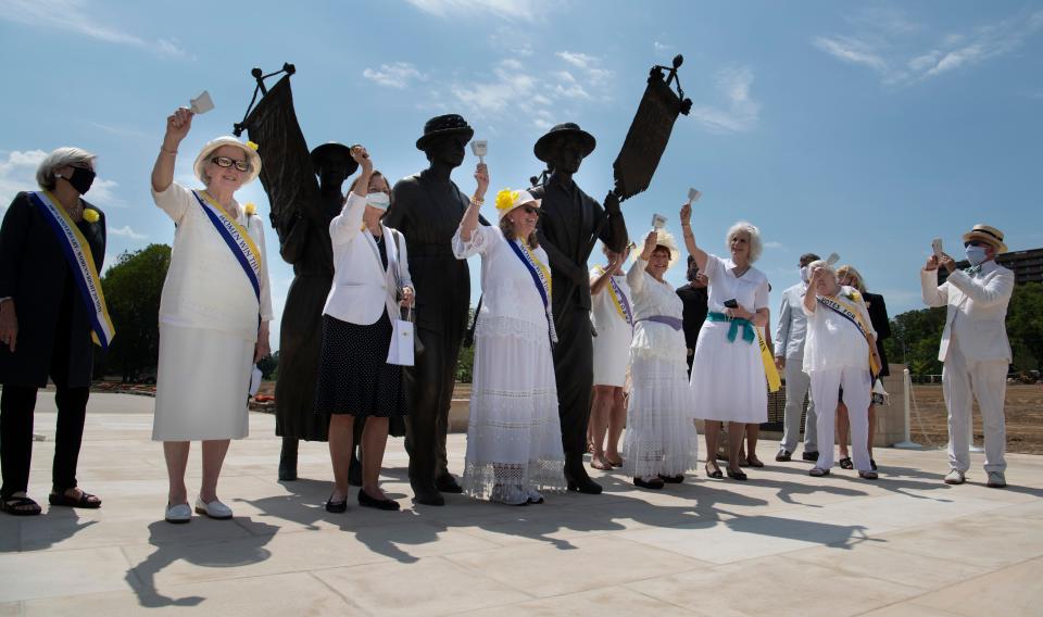 Members of the Tennessee Woman Suffrage Movement ring bells during the dedication of the monument at Centennial Park Tuesday, Aug. 18, 2020 in Nashville, Tenn. 