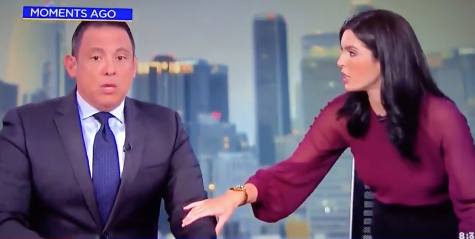 Sara Donchey clasping her co-anchor's arm as they broadcast during the Southern California earthquake. 