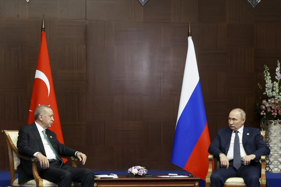 Russian President Vladimir Putin, right, and Turkey's President Recep Tayyip Erdogan talk to each other during their meeting on sidelines of the Conference on Interaction and Confidence Building Measures in Asia (CICA) summit, in Astana, Kazakhstan, Thursday, Oct. 13, 2022. (Vyacheslav Prokofyev, Sputnik, Kremlin Pool Photo via AP)