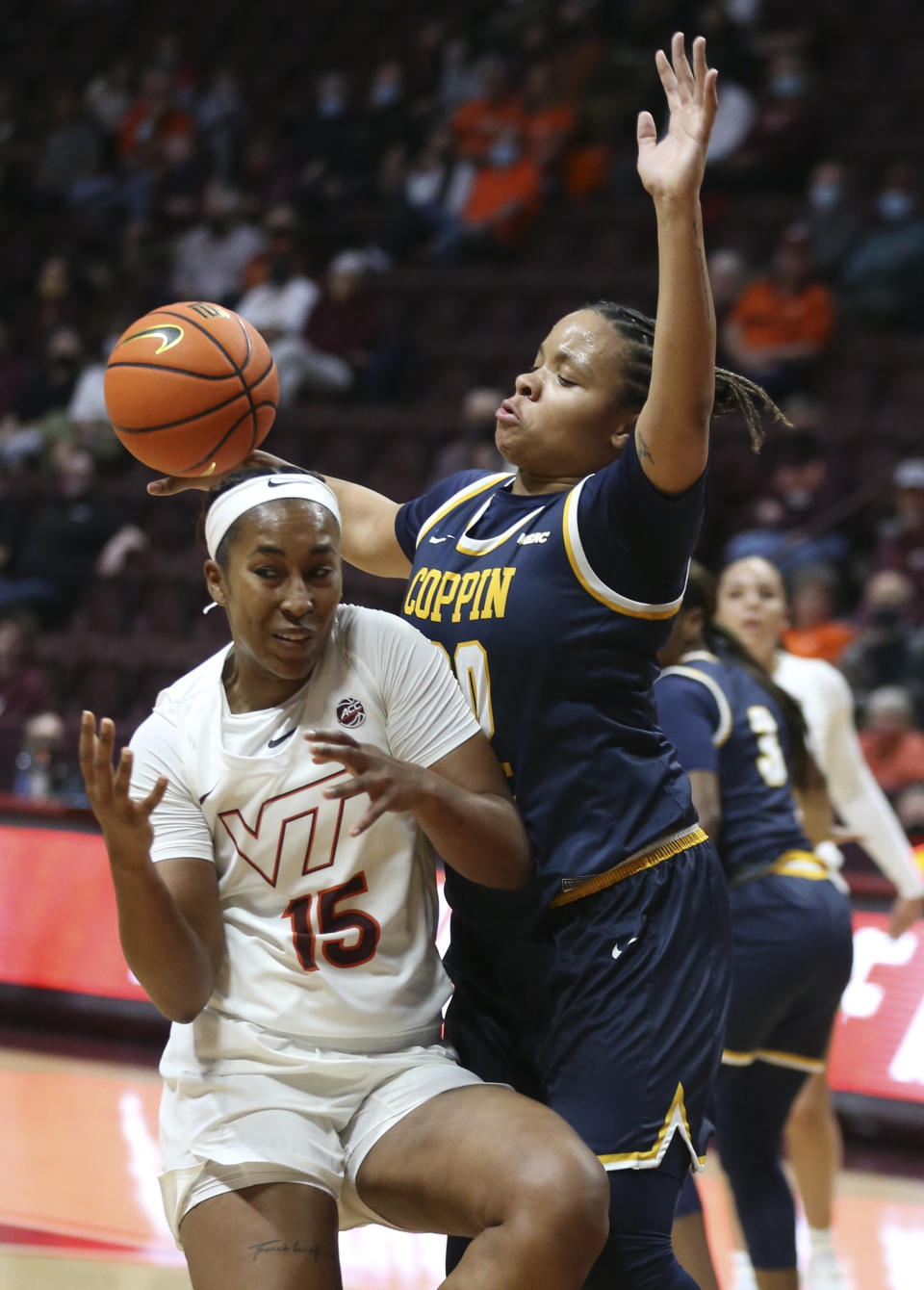 Virginia Tech's Azana Baines (15) loses control of the ball as Coppin State's Jaia Alexander (20) defends during in the first half of an NCAA college basketball game in Blacksburg Va., Wednesday, Nov. 17 2021. (Matt Gentry/The Roanoke Times via AP)