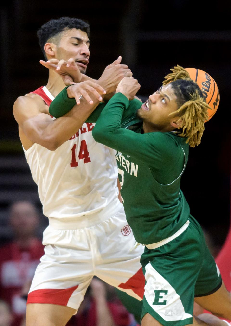 Bradley's Malevy Leons (14) collides with Eastern Michigan's Noah Farrakhan after blocking his shot in the first half Tuesday, Nov. 15, 2022 at the Peoria Civic Center. The Braves beat the Eagles 89-61.