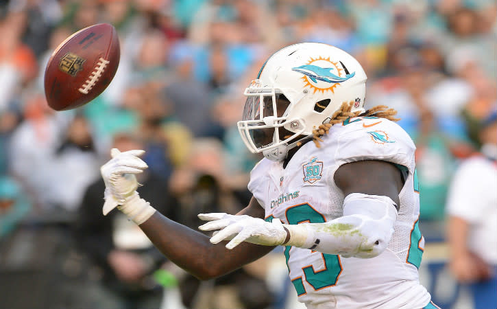 Dec 20, 2015; San Diego, CA, USA; Miami Dolphins running back Jay Ajayi (23) flips the ball after a touchdown in the third quarter of the game against the San Diego Chargers at Qualcomm Stadium. Mandatory Credit: Jayne Kamin-Oncea-USA TODAY Sports