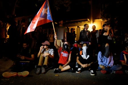 Demonstrators sit-in to block the exit of Pedro Pierluisi's convoy after his first news conference as Governor of Puerto Rico in San Juan