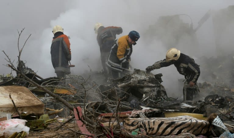 Rescue personnel work at the crash site of a Turkish cargo plane in the village of Dacha-Suu outside Bishkek, on January 16, 2017