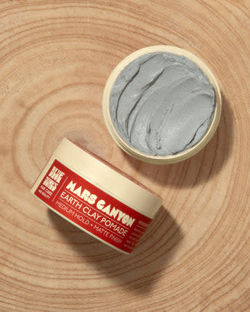 Mars Canyon Pomade on brown circular brown background. 