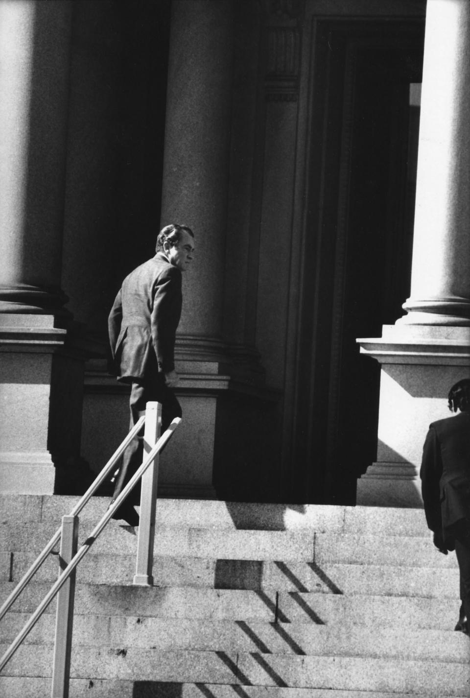 WASHINGTON - OCTOBER 25:  (NO U.S. TABLOID SALES)  US President Richard Nixon hurries up the steps of the Executive Office Building after briefing Congressional leaders in the Middle East Crisis on October, 25 1973 in Washington, DC.  (Photo by David Hume Kennerly/Getty Images)