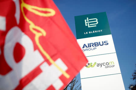 Unions members gather outside the Airbus Groupe site in Suresnes, near Paris, France, December 15, 2016. European planemaker Airbus is to cut a net total of 934 jobs, including the closure of a site at Suresnes just outside Paris, said a French trade union, as part of a previously announced restructuring. REUTERS/Benoit Tessier