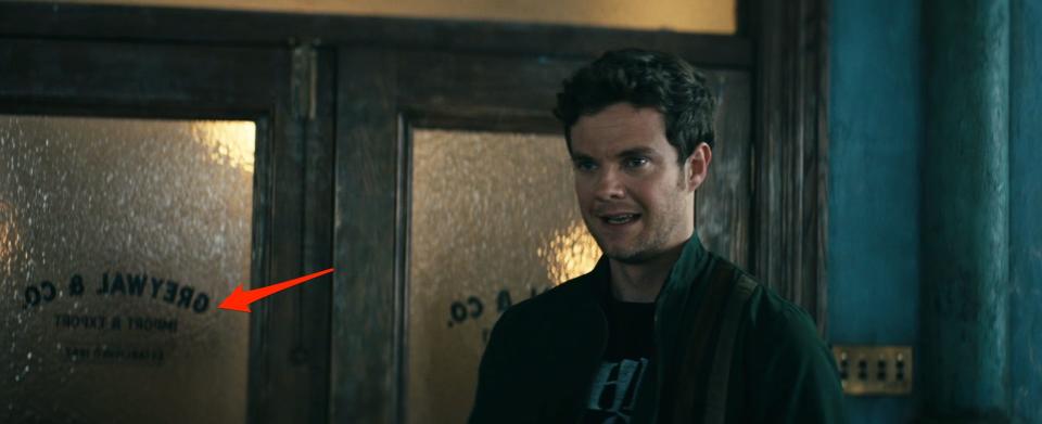 A red arrow pointing to a door behind Hughie in season three of "The Boys."