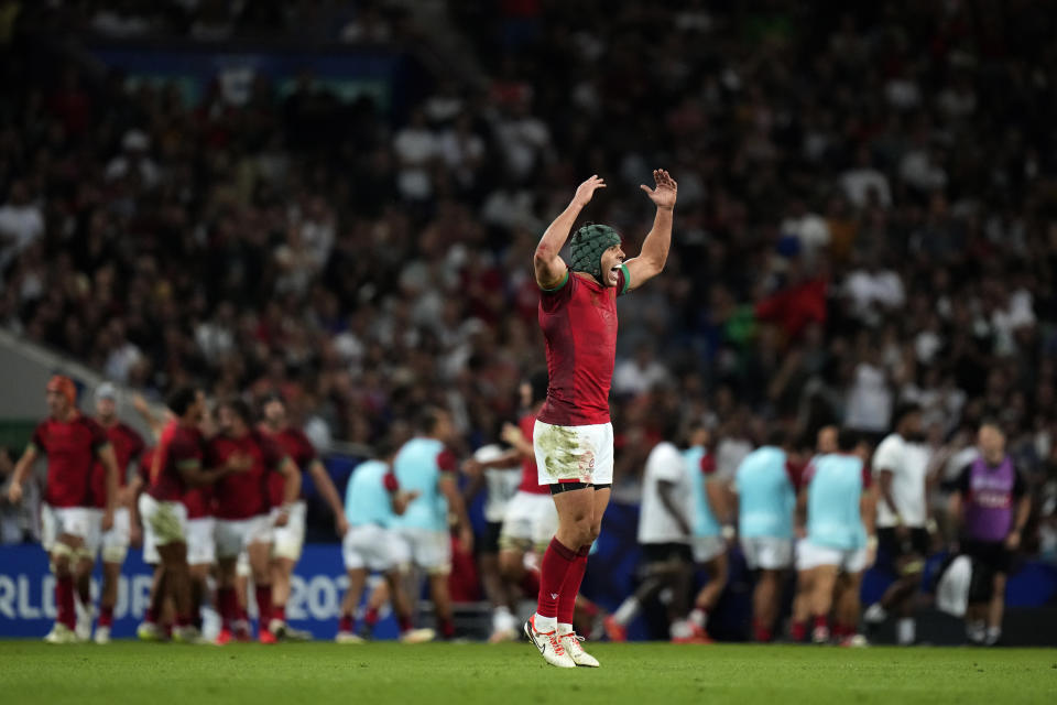 Portugal's Pedro Bettencourt celebrates after teammate scored a try during the Rugby World Cup Pool C match between Fiji and Portugal, at the Stadium de Toulouse in Toulouse, France, Sunday, Oct. 8, 2023. (AP Photo/Pavel Golovkin)