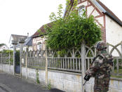 <p>A French soldiers stands guard as he prevents the access to the scene of an attack in Saint-Etienne-du-Rouvray, Normandy, France, Tuesday, July 26, 2016. (AP Photo/Francois Mori)</p>