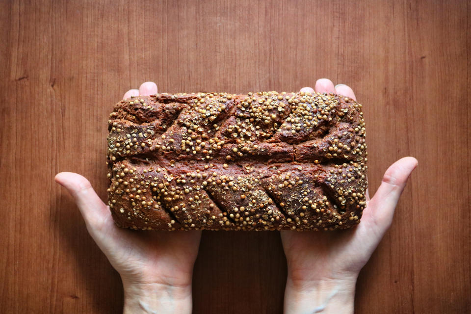 Trading white bread for whole grain loafs like rye is a delicious way to decrease sugar. (Photo: Getty Images)