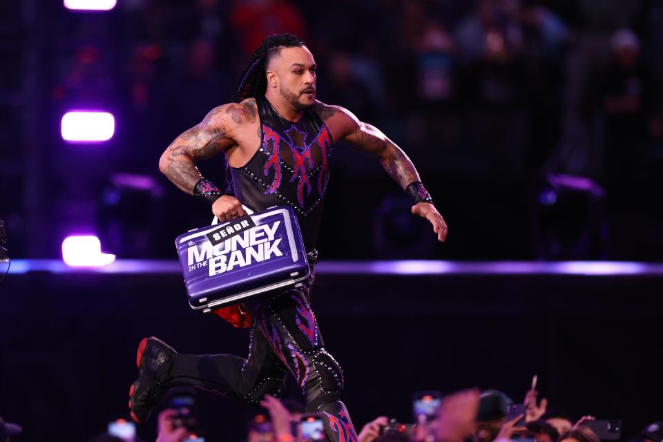 Damian Priest runs to cash in the Money in the Bank briefcase during Night Two at Lincoln Financial Field on April 07, 2024 in Philadelphia, Pennsylvania.