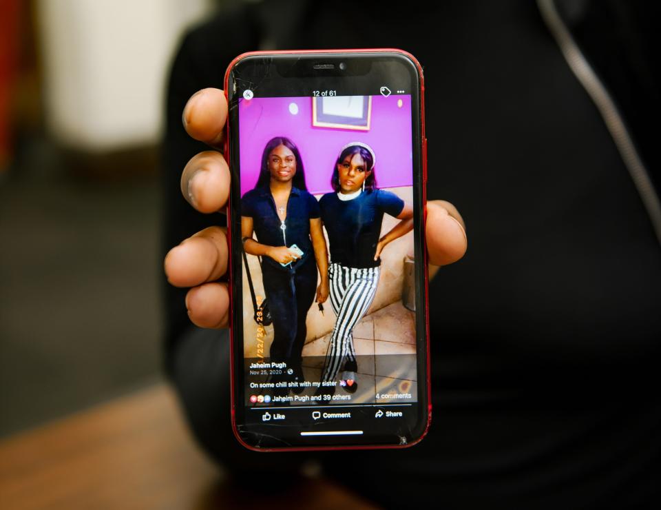 Ja'Koya Dowdell with a photograph she saved of her and Pugh, her chosen sister.