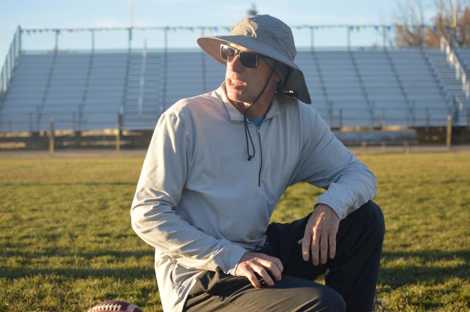 Fall River coach Todd Sloat looks back at his scout team defense before snapping a ball to senior quarterback Ryan Osborne on Wednesday, Dec. 1, 2021.