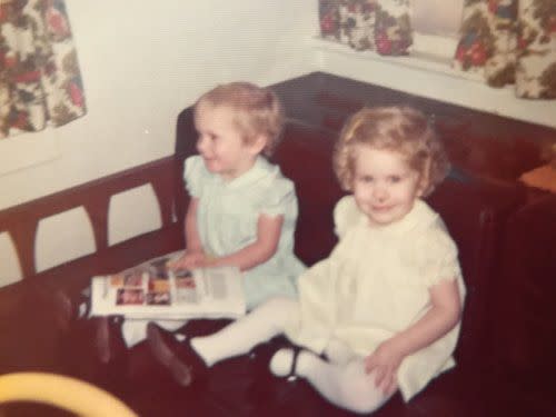 Twin sisters Tasha, left, and Tonya Cram, right, sit for picture book time. | Cram family photo