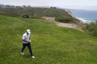 Brooks Koepka walks to the fourth tee during the first round of the U.S. Open Golf Championship, Thursday, June 17, 2021, at Torrey Pines Golf Course in San Diego. (AP Photo/Jae C. Hong)