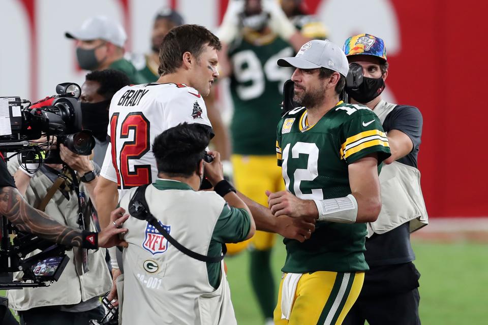 Tampa Bay quarterback Tom Brady shakes hands with Green Bay quarterback Aaron Rodgers after a game last season.