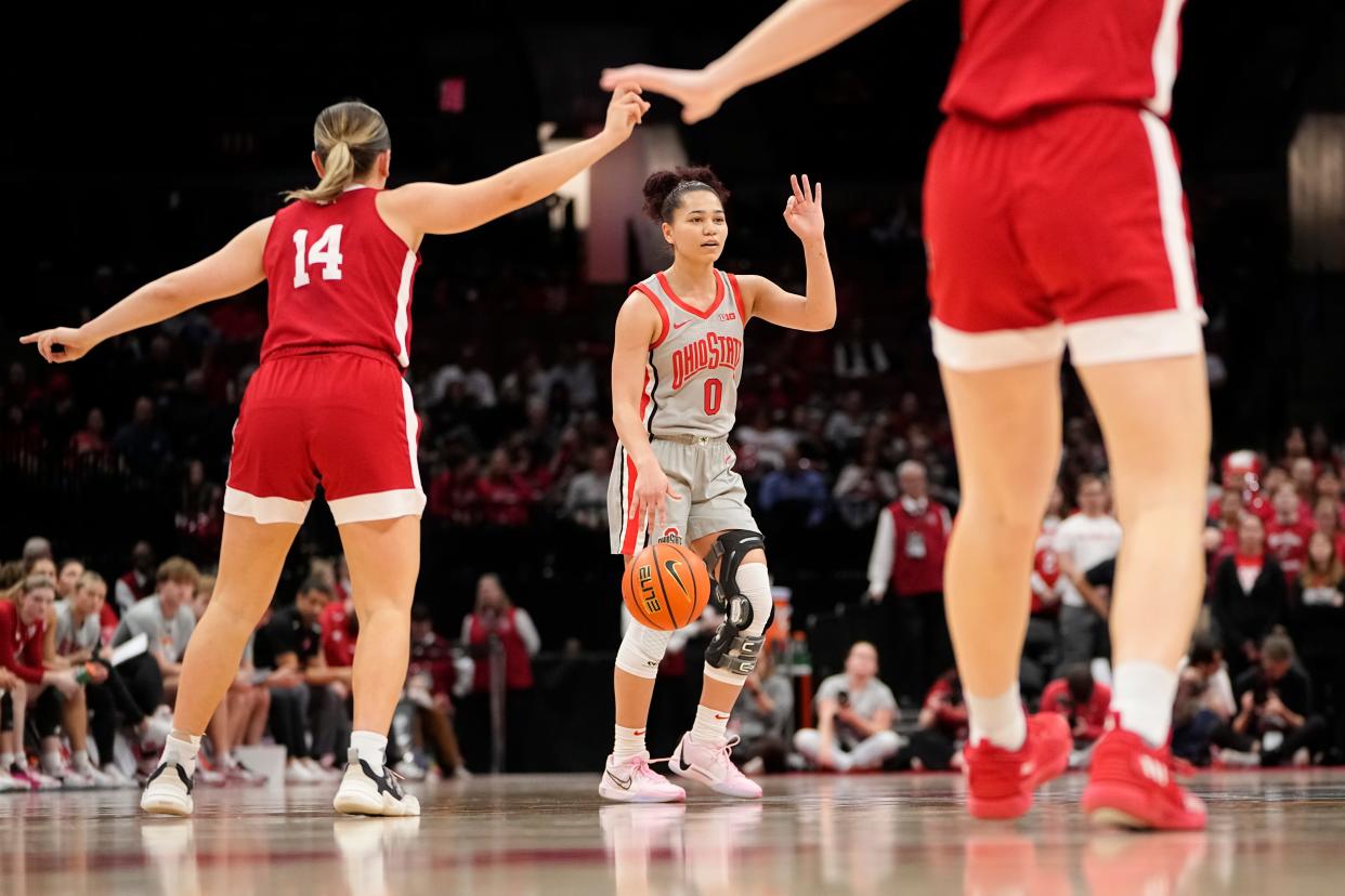 Feb 14, 2024; Columbus, Ohio, USA; Ohio State Buckeyes guard Madison Greene (0) dribbles upcourt toward Nebraska Cornhuskers guard Callin Hake (14) during the second half of the NCAA women’s basketball game at Value City Arena. Ohio State won 80-47.