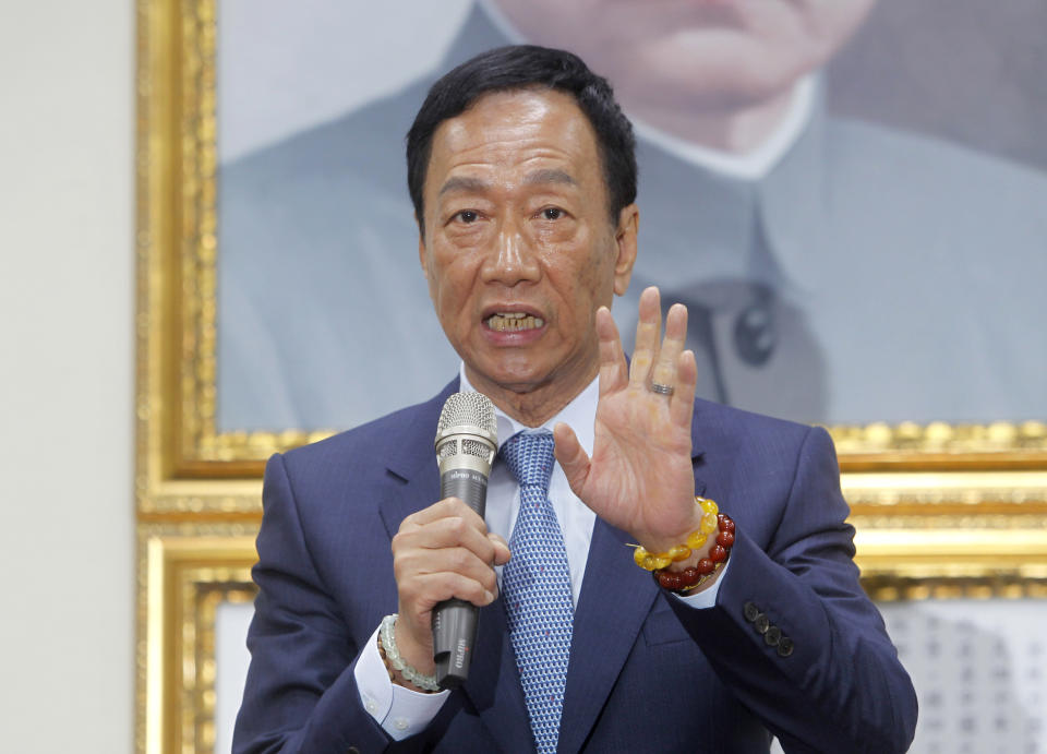 Terry Gou, the head of the world's largest electronics supplier Foxconn, speaks to the media after meeting with Nationalist Party chairman Wu Den-yih at the party headquarters in Taipei, Taiwan, Monday, May 13, 2019. Gou plans to run for president of Taiwan, bringing his pro-business and pro-China policies to what is expected to be a crowded field for next year's election. (AP Photo/Chiang Ying-ying)