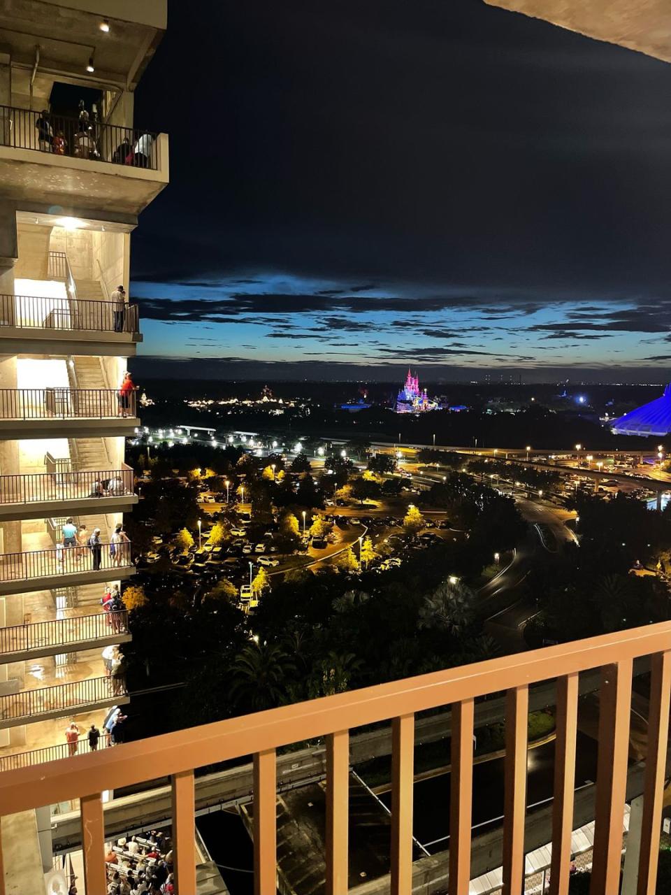 a view of magic kingdom at night from disney contemporary hotel
