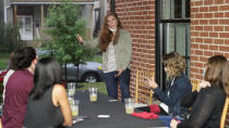 Katie Paris speaks to members of Red, Wine and Blue during a meeting, Monday, Sept. 28, 2020, in Cleveland.With perennial swing-state Ohio appearing to be a toss-up in recent polling, the roles of campaign volunteers and grassroots groups in generating enthusiasm and turning out the vote likely will be crucial in the battle for the state’s 18 electoral votes. With names such as Red, Wine and Blue, Bold New Democracy and Ohio Battleground Alliance, they enable volunteers to pitch in even if they're pinned down at home with children, caregiving needs or their own health concerns. (AP Photo/Tony Dejak)