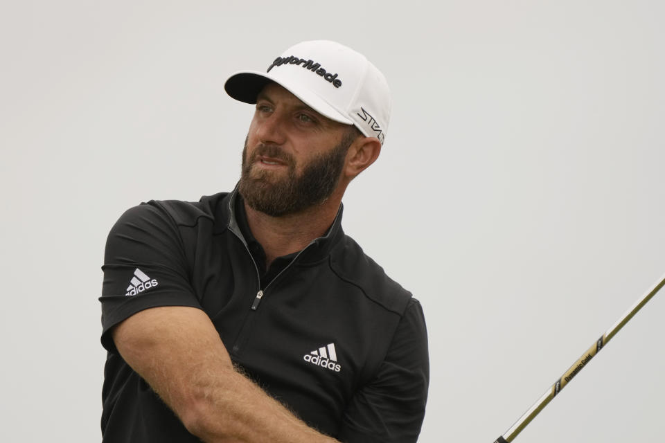 Dustin Johnson of the US watches his shot along the 11th fairway during the second round of the British Open golf championship on the Old Course at St. Andrews, Scotland, Friday July 15, 2022. The Open Championship returns to the home of golf on July 14-17, 2022, to celebrate the 150th edition of the sport's oldest championship, which dates to 1860 and was first played at St. Andrews in 1873. (AP Photo/Gerald Herbert)