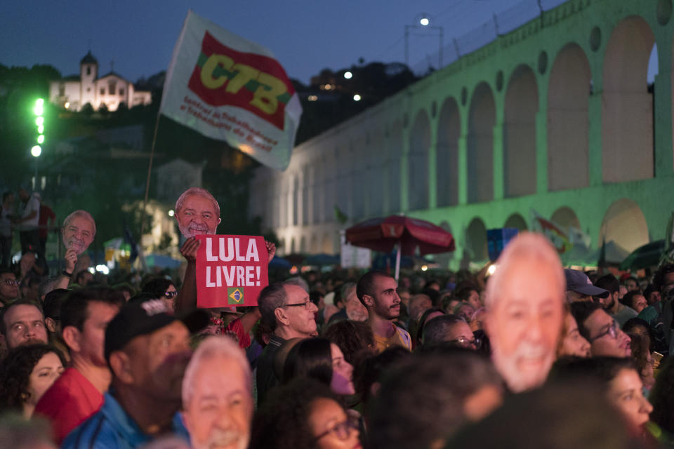 People gather for the Lula Free festival in Rio de Janeiro, Brazil, Saturday, July 28, 2018. Popular Brazilian musicians and social movements organized a concert to call for the release of Brazil's former president Luiz Inacio Lula da Silva, who has been in prison since April, but continues to lead the preferences on the polls ahead of October's election. (AP Photo/Leo Correa)